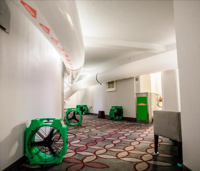 Drying equipment and air ducts set up in an Atlanta hotel that flooded