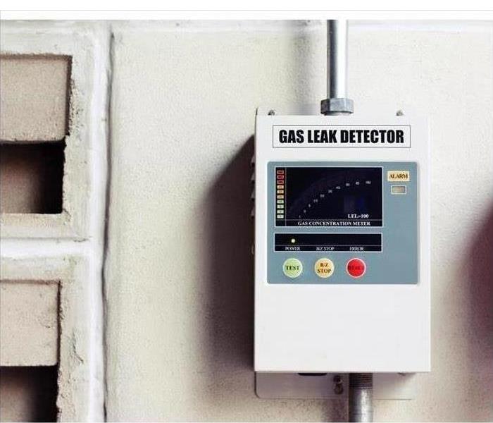 gas leak detector box on cement wall